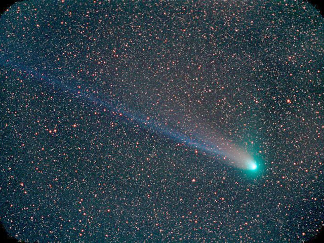 Photographic mage showing the tails of a comet across the night sky